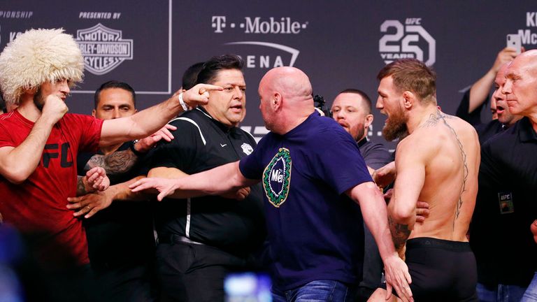 Khabib Nurmagomedov, left, points at Conor McGregor as the two are pulled apart during a ceremonial weigh-in for the UFC 229 mixed martial arts fight Friday, Oct. 5, 2018, in Las Vegas. (AP Photo/John Locher)