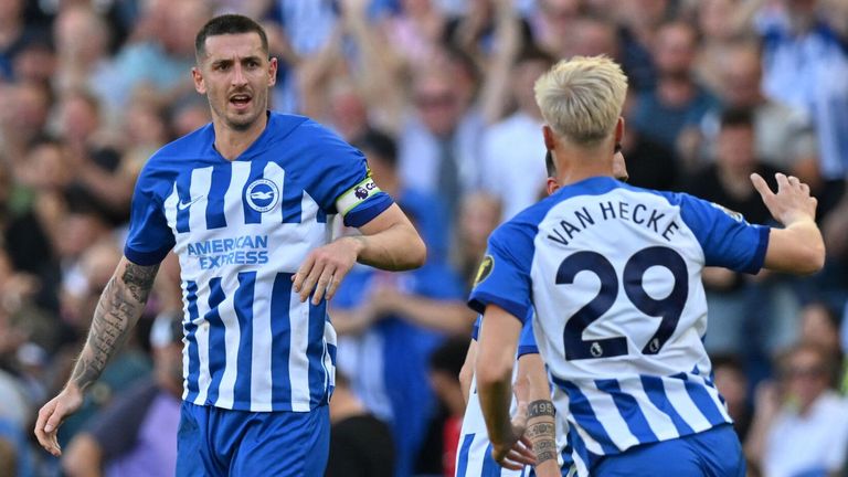 Lewis Dunk celebrates after Brighton pull a goal back