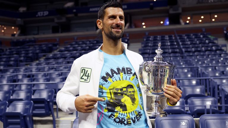 Novak Djokovic of Serbia poses for the media with his winners trophy wearing a shirt as a tribute to the late Kobe Bryant after defeating Daniil Medvedev of Russia during their Men&#39;s Singles Final match on Day Fourteen of the 2023 US Open at the USTA Billie Jean King National Tennis Center on September 10, 2023 in the Flushing neighborhood of the Queens borough of New York City. (Photo by Clive Brunskill/Getty Images)