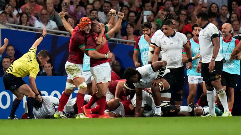 Portugal&#39;s players celebrates a try in their stunning win against Fiji